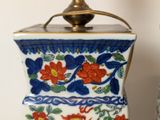 two vases that have been decorated with flowers on them