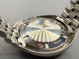 a close up of a watch on a table