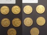 les deux faces d'une pièce d'or sur laquelle figurent l'effigie d'un homme et d'une femme