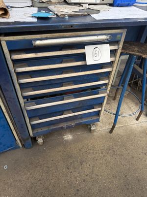 an image of a workbench with a lot of tools on it