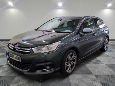 the grey citrole is parked on a checkered tile floor