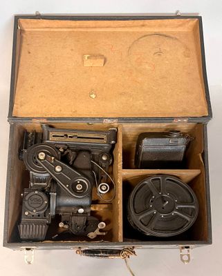 a box with a camera inside of it on a white surface