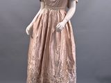 a mannequin dress on display on a mannequin stand