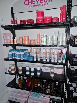 a shelf full of cosmetic products in the corner of the room