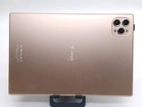 the back of a gold cell phone with a camera attached to it