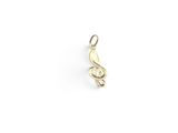 a gold treble charm on a white background