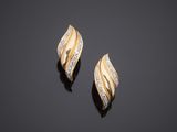 a pair of gold and diamond earrings
