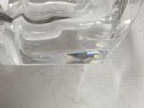 a close up of a glass of water on a table