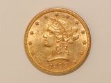 an image of a gold coin with a woman ' s head on it