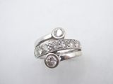 a close up of a ring with a diamond on top of it