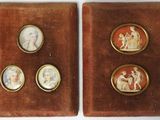 two antique cameos of women and children in a velvet case