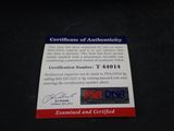 a certificate on a black table with a red and blue background