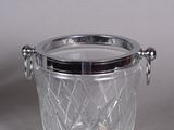 a glass ice bucket with a metal lid