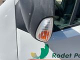 a close up of a white truck with a logo on the side of it