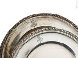 a silver plate that is sitting on top of a table