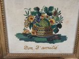 an old picture of a basket of fruit on a table
