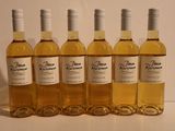 six bottles of wine are lined up on a table