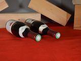 three bottles of wine sitting next to each other on a table