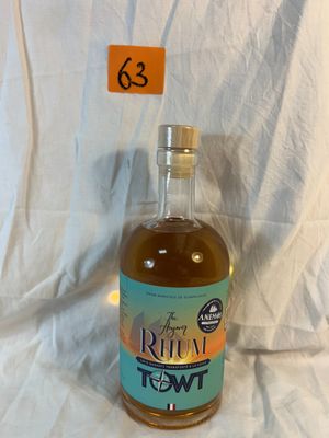 a bottle of alcohol sitting on a table with a price tag in front of it