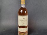 an image of a bottle of wine sitting on top of a table