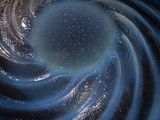 a close up view of a blue bowl with water in it