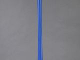 a blue glass vase on a gray background