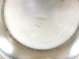 a silver plate that has a silver handle on it