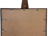 an image of a wooden easel with a piece of paper attached to it