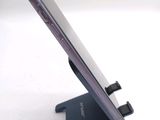 a close up of a cell phone on a stand
