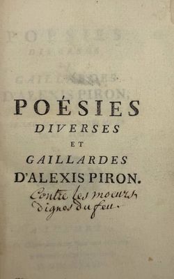 an old book with writing on it sitting on a table