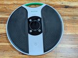 a remote control sitting on top of a record on a table
