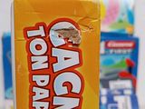 a box of candy sitting on a table next to a box of candy