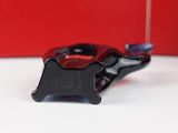 a black and red object on a white table