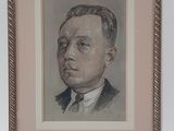 portrait of a man in a suit and tie in a frame