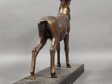 bronze sculpture of a stag on a marble base