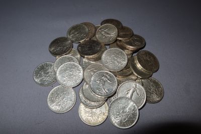 a pile of silver coins sitting on a table