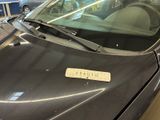 a car that has a sticker on the hood of it