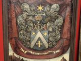 an old painting of a coat of arms with a cross on it