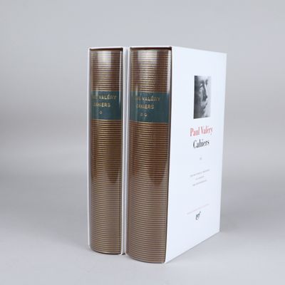 the two books are sitting on the table next to each other