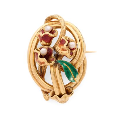 une image représentant une broche en or ornée de fleurs et de perles