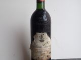 a bottle of wine that is sitting on a table