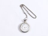 silver pocket watch with chain on a white background