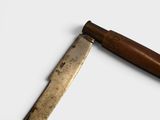 a knife that is laying on a table