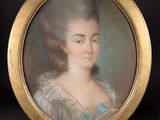 portrait of a lady in a blue dress in a gold frame