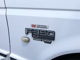 a close up of a white truck with a sticker on it