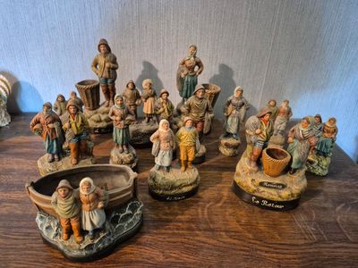 many figurines that are sitting on a table