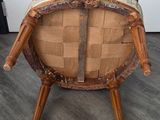 a chair made out of wood with a woven seat and legs