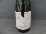 a bottle of wine that is sitting on a table