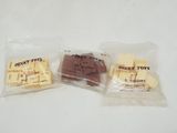 two bags of candy sitting next to each other on a table