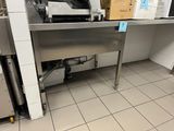 a machine that is sitting on a table in a kitchen